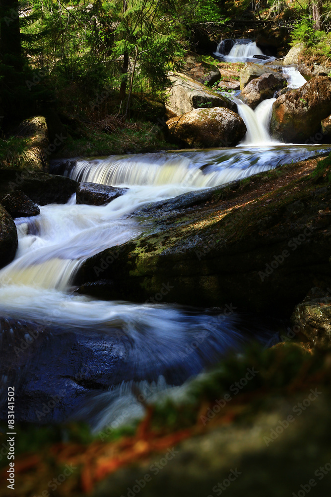 Cascading waterfalls in mountain forest Cascading waterfalls in mountain forest