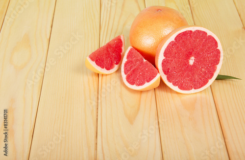Grapefruits segments on a wooden table