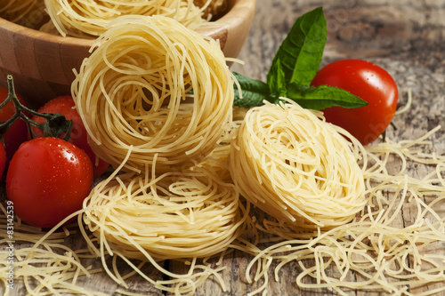 Dry Italian pasta fidellini, selective focus