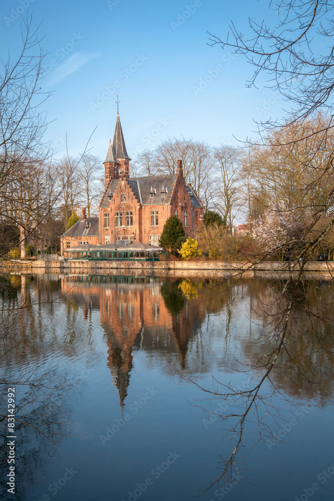 Medieval Castle on Love lake, Minnewater Park in Bruges, Belgium