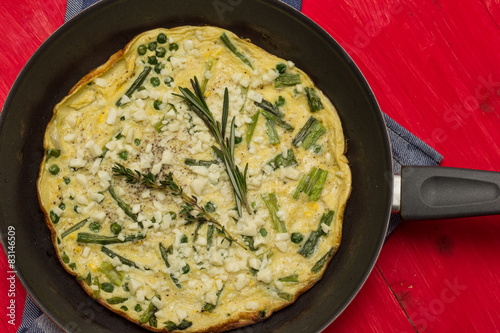 Italian frittata with spring onions and peas