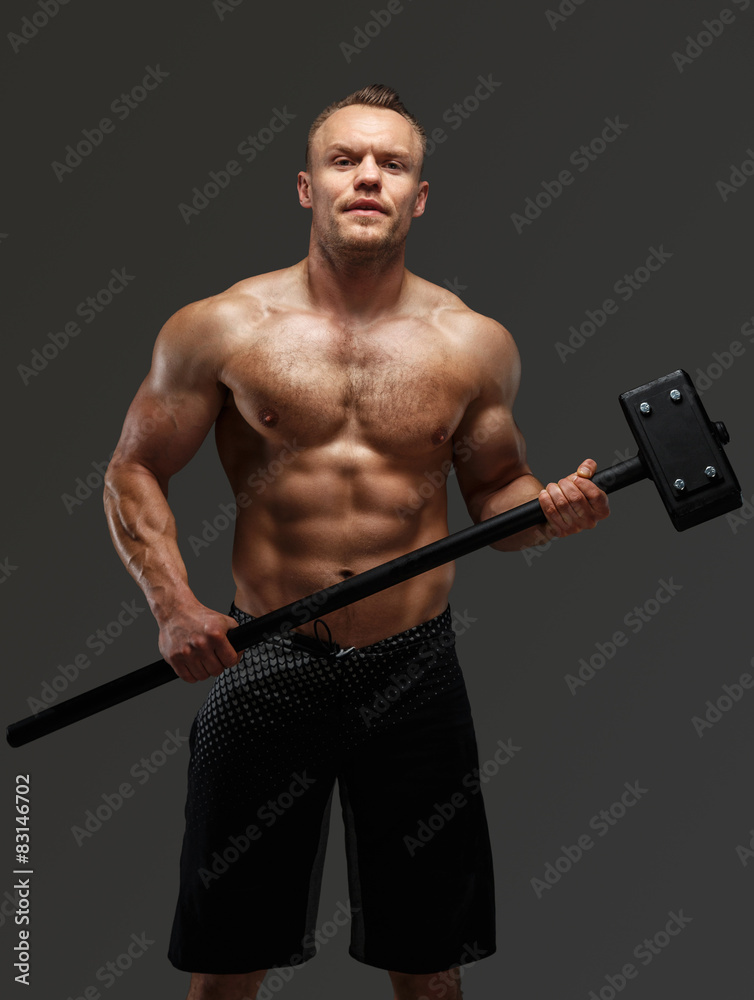 Muscular man holding hummer Muscular man holding hummer