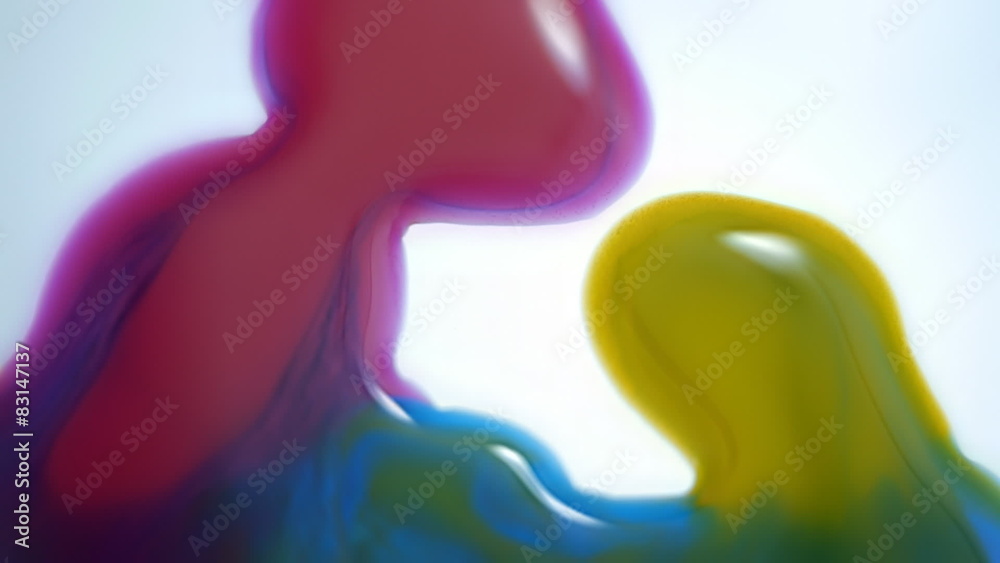 Drops of paint of different colors on a white surface Drops of paint of different colors on a white surface