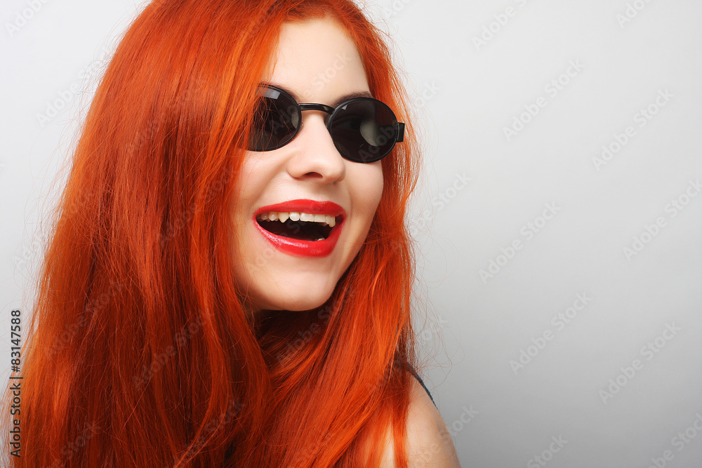 Young surprised woman wearing sunglasses. Young surprised woman wearing sunglasses.