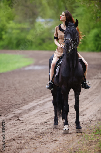 beautiful girl riding a horse