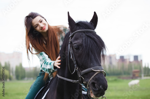 beautiful girl riding a horse