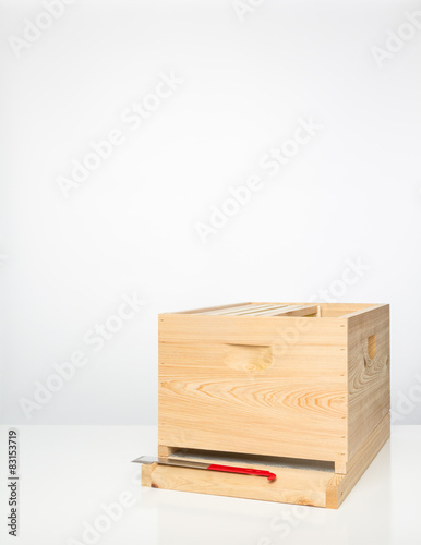 Parts of Langstroth beehive with hive tool