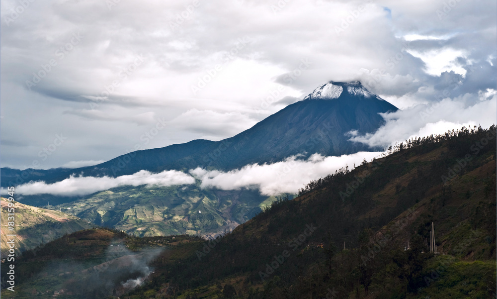 Fototapeta premium Eruption of a volcano Tungurahua and town Banos de Agua Santa