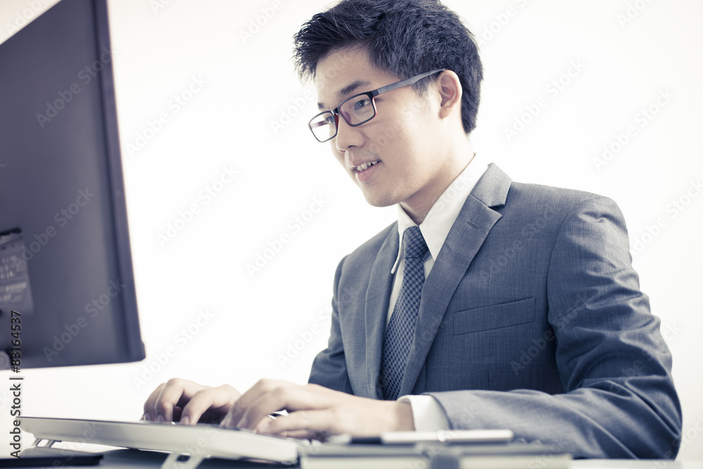 Handsome businessman working with laptop Handsome businessman working with laptop