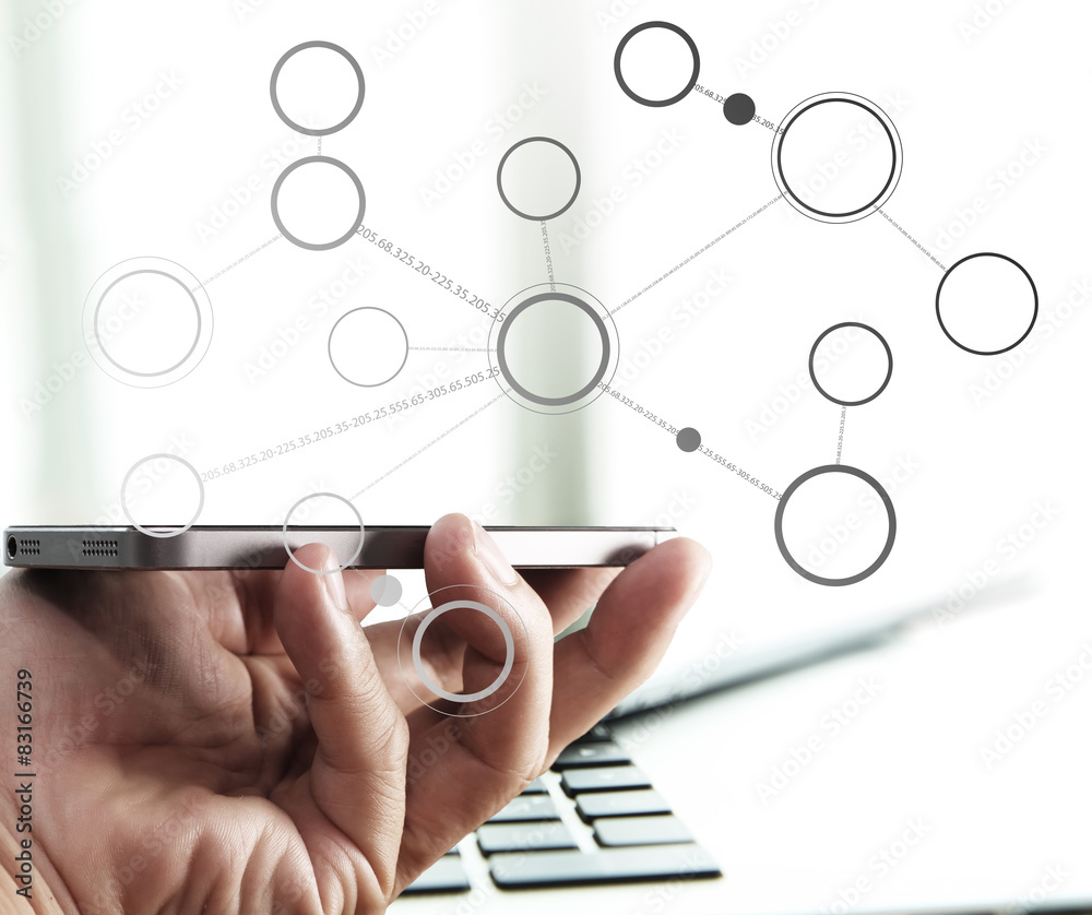Businessman hand using laptop and mobile phone in office Businessman hand using laptop and mobile phone in office