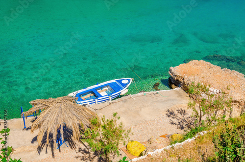   Small motorbat docked in peaceful bay photo
