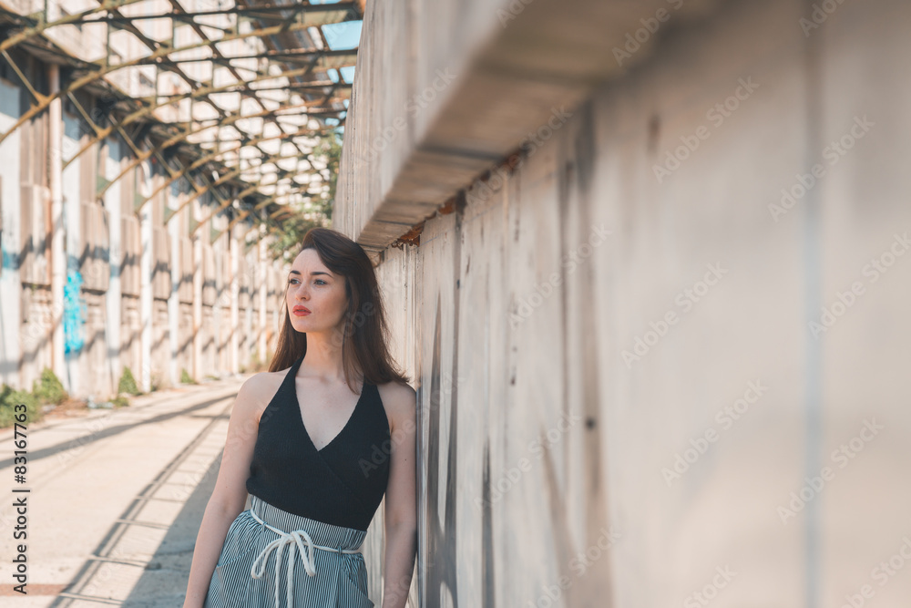 Beautiful brunette posing in an industrial context Beautiful brunette posing in an industrial context