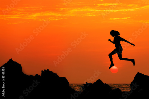silhouette jumping relax at sunset