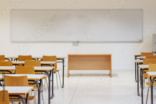 Desk and chairs in classroom