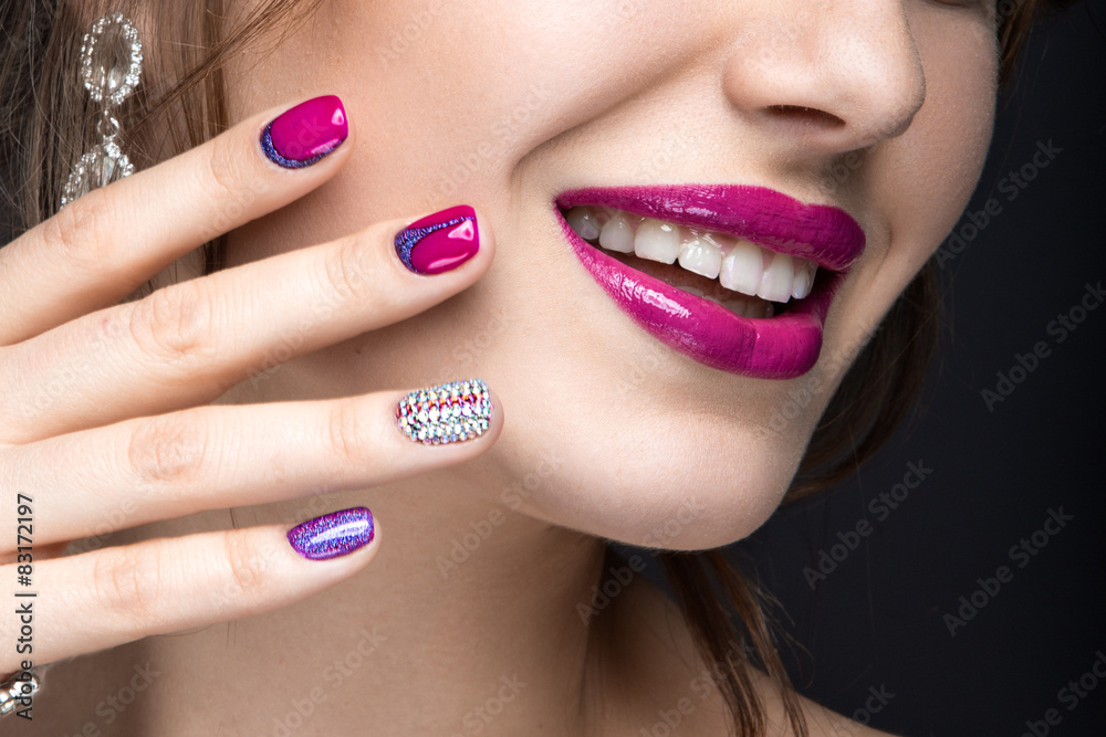 Fototapeta premium girl with a bright make-up and manicure with rhinestones.