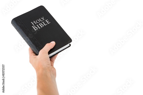Hand holding bible