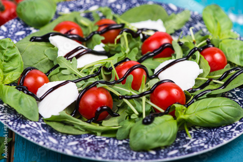 Healthy diet salad with tomatoes, mozzarella,basil and balsamic