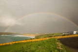 Rainbow at Crantock beach in Cornwall England UK