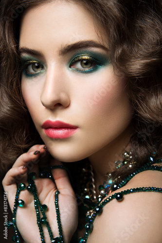 Close-up portrait of beautiful woman with bright make-up