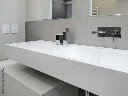 foreground of a washbasin in modern bathroom