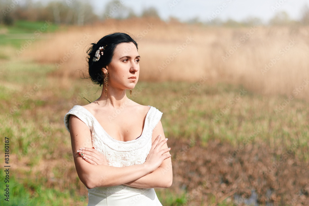The lonely bride with flowers in a hairstyle The lonely bride with flowers in a hairstyle