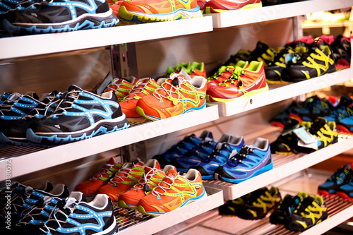 Shelves with sport shoes, sport store