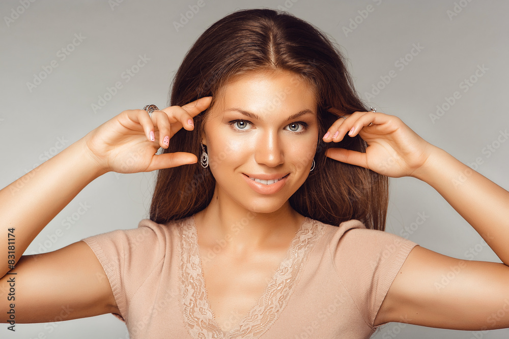 Fototapeta premium Portrait of Beautiful Woman with Long Hair and Clean Skin