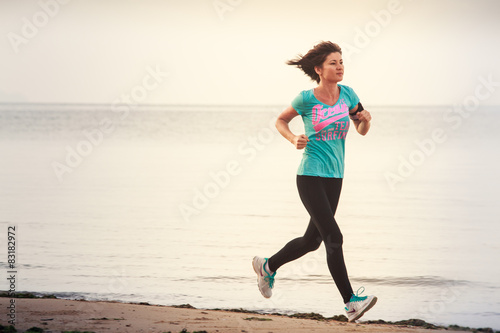 girl runs on beach at dawn