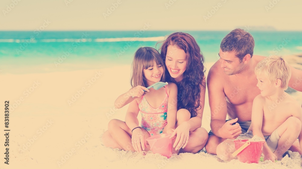 Fototapeta premium Portrait of a family at the beach
