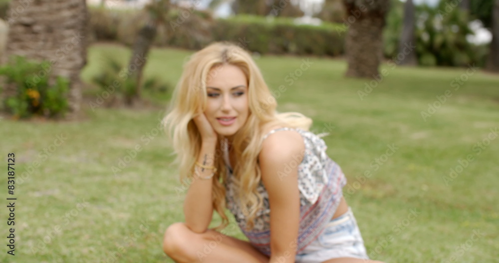 Smiling Attractive Blond Woman at the Garden Smiling Attractive Blond Woman at the Garden