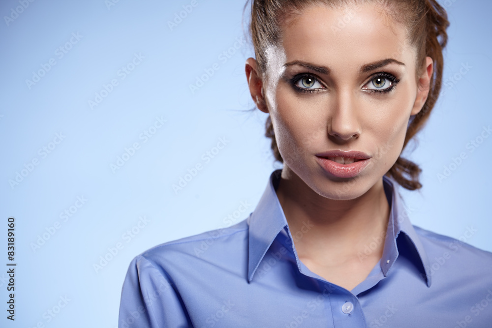 Portrait of a beautiful young business woman standing against bl Portrait of a beautiful young business woman standing against bl