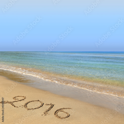 2016 written on sandy beach