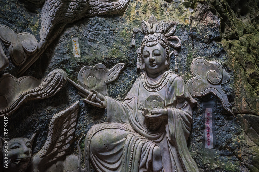 Sculpture of Buddha inside Am Phu Cave Danang