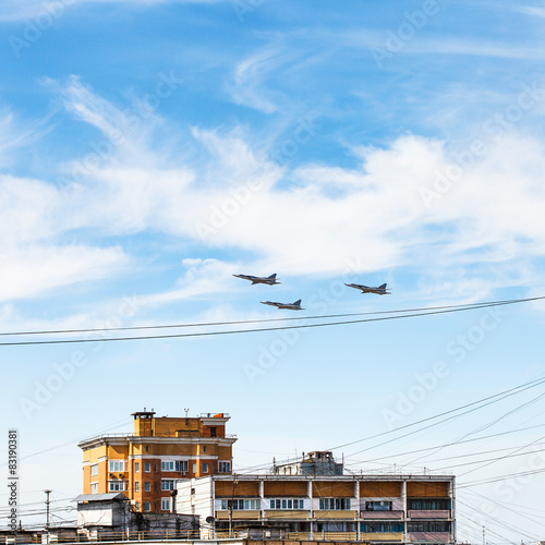 military aircrafts flight over urban house