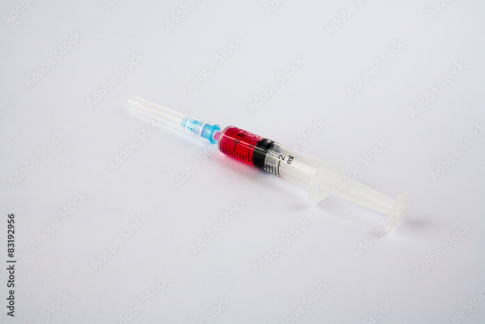 syringe with red liquid syringe with red liquid