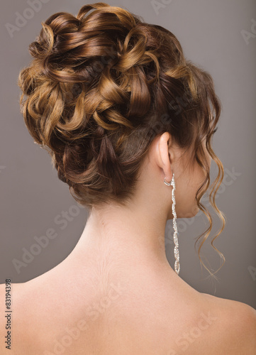 Girl in the image of the bride. hairstyle back view