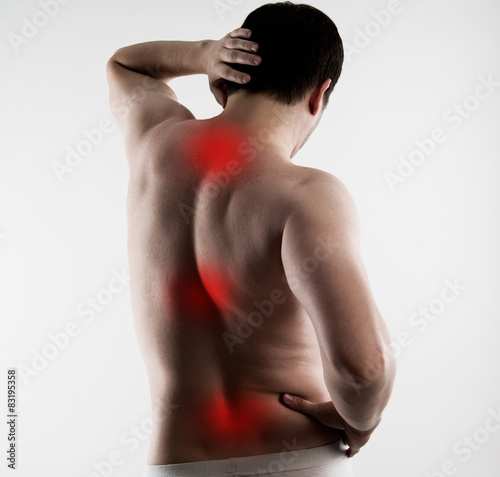 Reflexology. Spinal pain cure. Young male body with red points