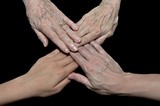 family generations of four hands on black