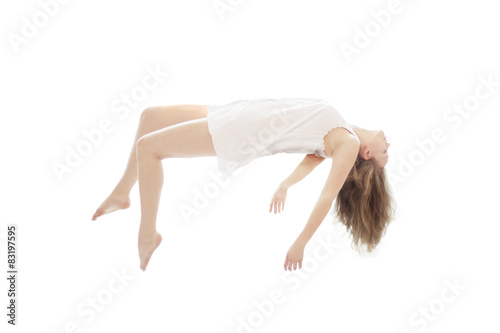 Young beautiful woman floating on white background