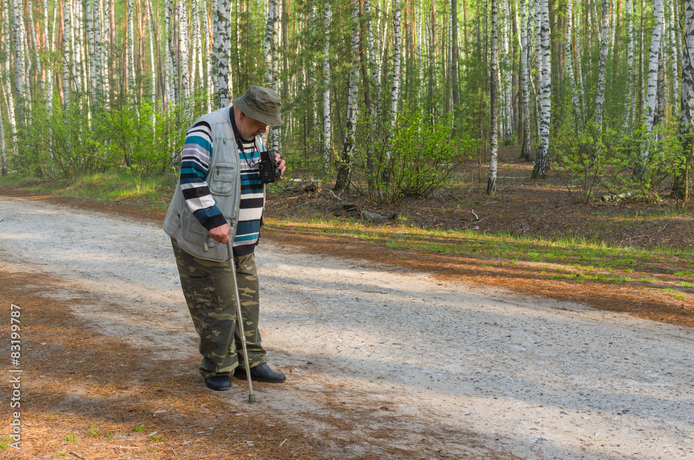 Senior photographer making photo with old film camera Senior photographer making photo with old film camera