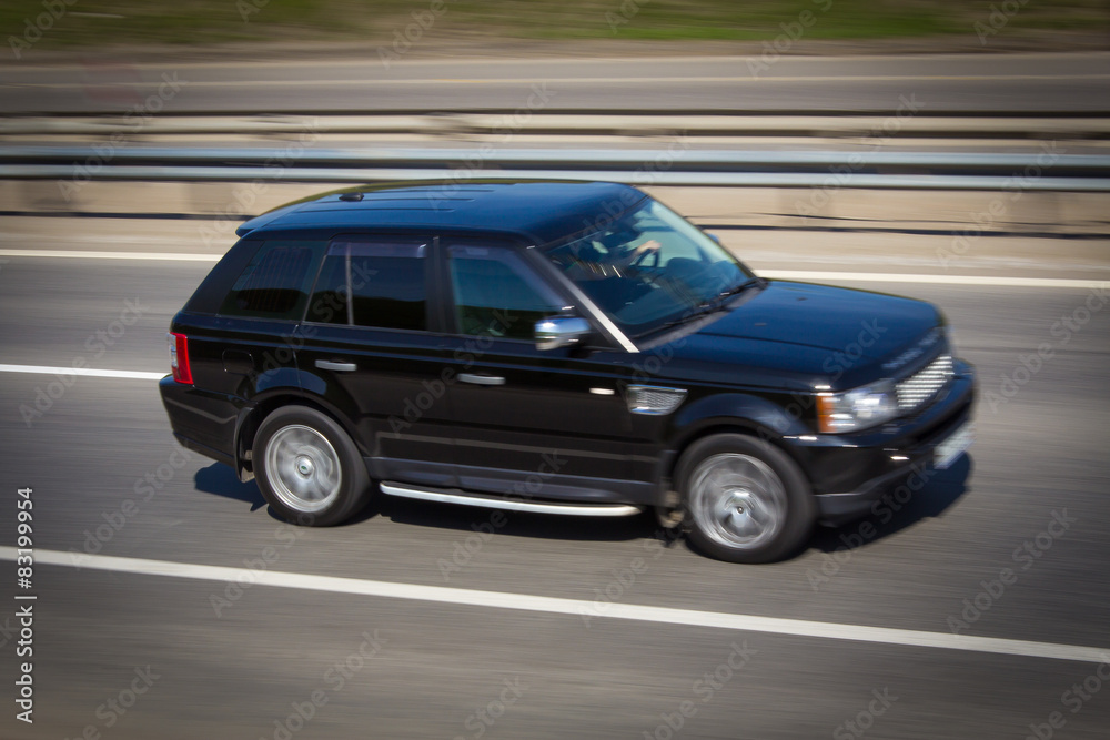 black Range Rover SUV quickly goes on the road