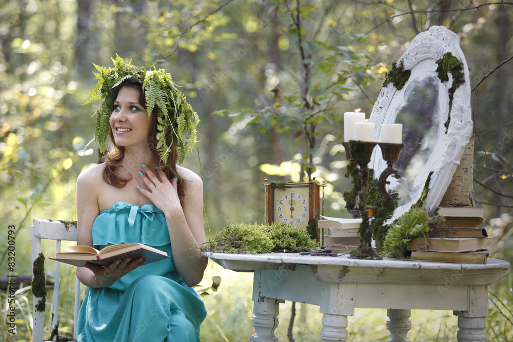 Naklejka premium Beautiful model in the woods in a vintage scenery