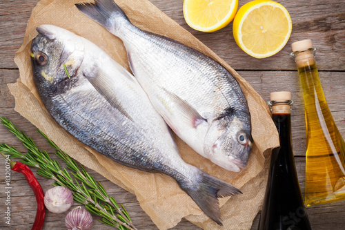 Fresh dorado fish cooking with spices and condiments