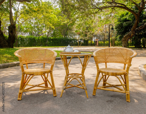 Wooden Rattan Chairs with Set of Tea on Table for Afternoon Tea