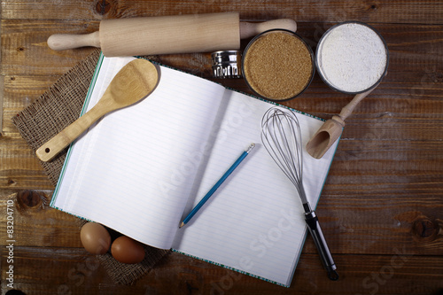 Set of ingredients and appliances with recipe book photo