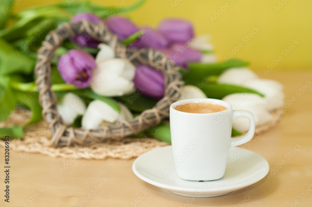 tulips on the table with cup of caffee