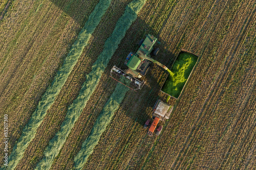 aerial view of harvest fields with combine