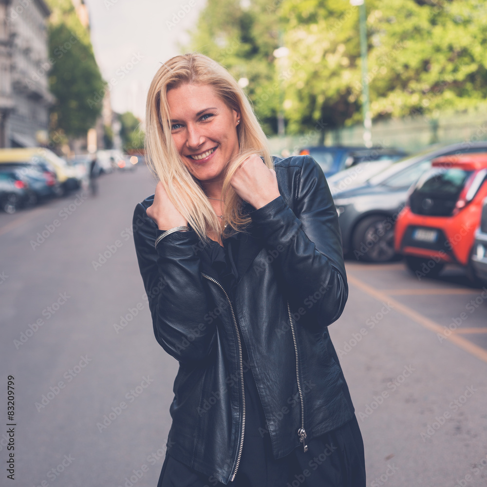 Fototapeta premium Beautiful girl posing in the city streets