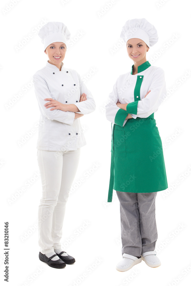full length portrait of two young women chefs isolated on white