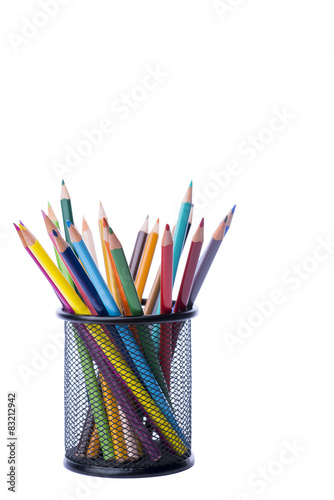 Bunch of color pencils in a stand over the white background